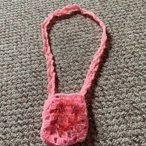 Hand knitted pink pouch